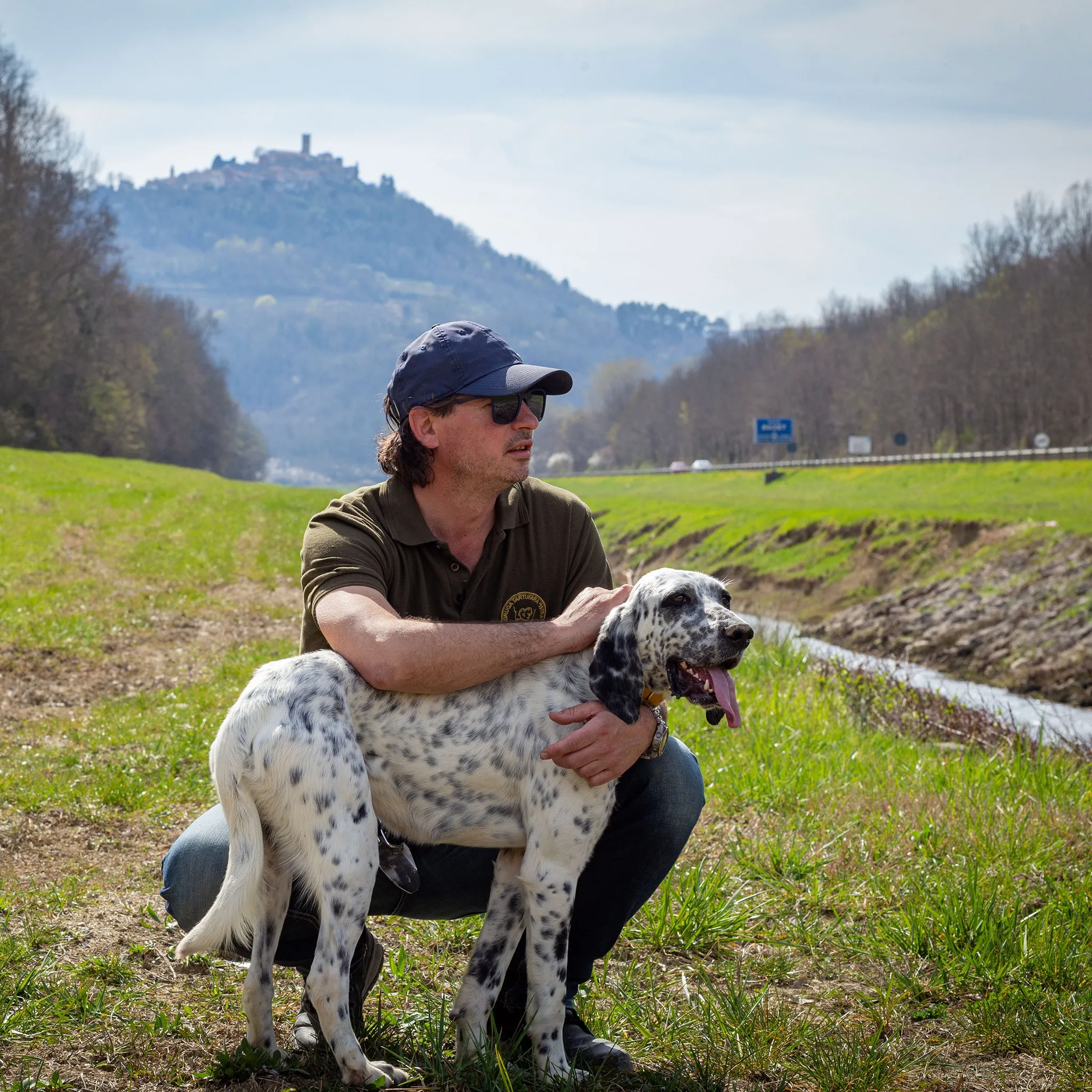 Motovun hill town and local truffle guide with dog in Istria